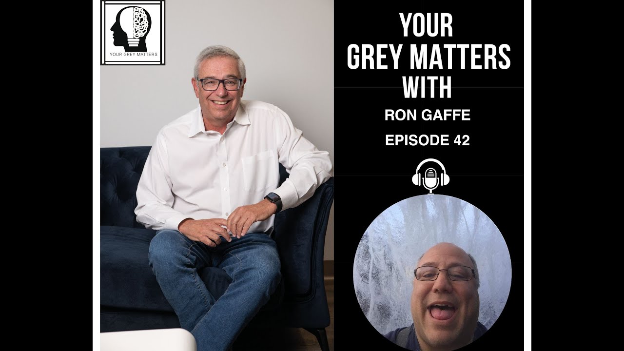 In Episode 42 of the Your Grey Matters podcast, hosts Neil and Jason sit down with Ron Gaffe. The image features Neil, seated on a couch, smiling and wearing a white shirt, and Ron, also smiling, appearing in an inset circle. The Your Grey Matters logo is displayed at the top left corner of the image. This episode explores Ron Gaffe's career as a wrestling manager and includes captivating wrestling stories and insights into the sports entertainment industry.